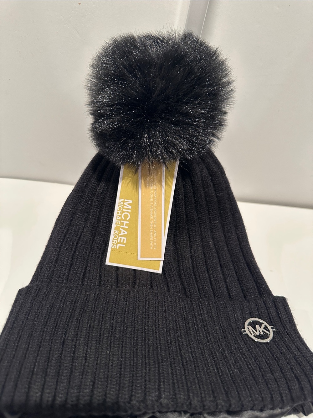 NWT Michael Michael Kors Black Beanie with Faux Fur Pompom and Satin Lining.